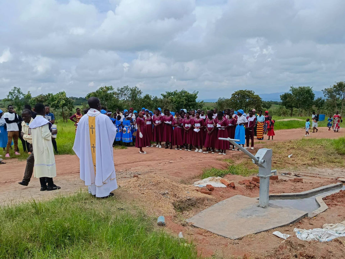 The blessing of Water of Mercy's first well, at Yotamu Village